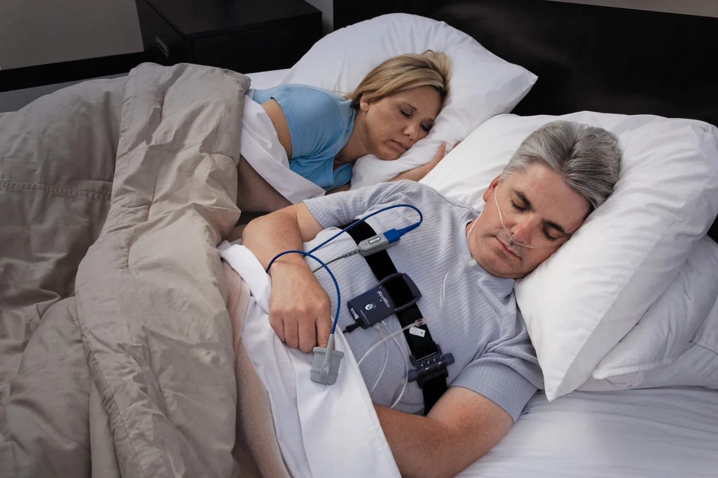 Patient wearing a home sleep study monitor overnight