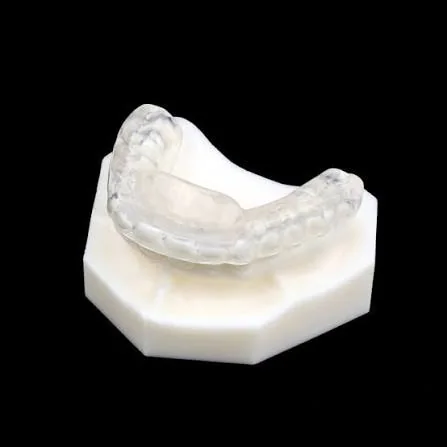 Jaw-repositioning splint shown on a dental model